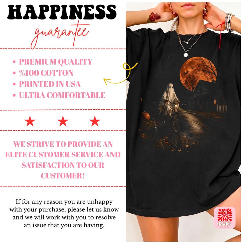 May include: A black t-shirt featuring a graphic print of a ghost riding a bicycle on a dark road at night under a large orange moon. The design includes a house, trees, and a pumpkin. The text on the left side reads HAPPINESS guarantee, PREMIUM QUALITY, 100% COTTON, PRINTED IN USA, ULTRA COMFORTABLE, and WE STRIVE TO PROVIDE AN ELITE CUSTOMER SERVICE AND SATISFACTION TO OUR CUSTOMER.