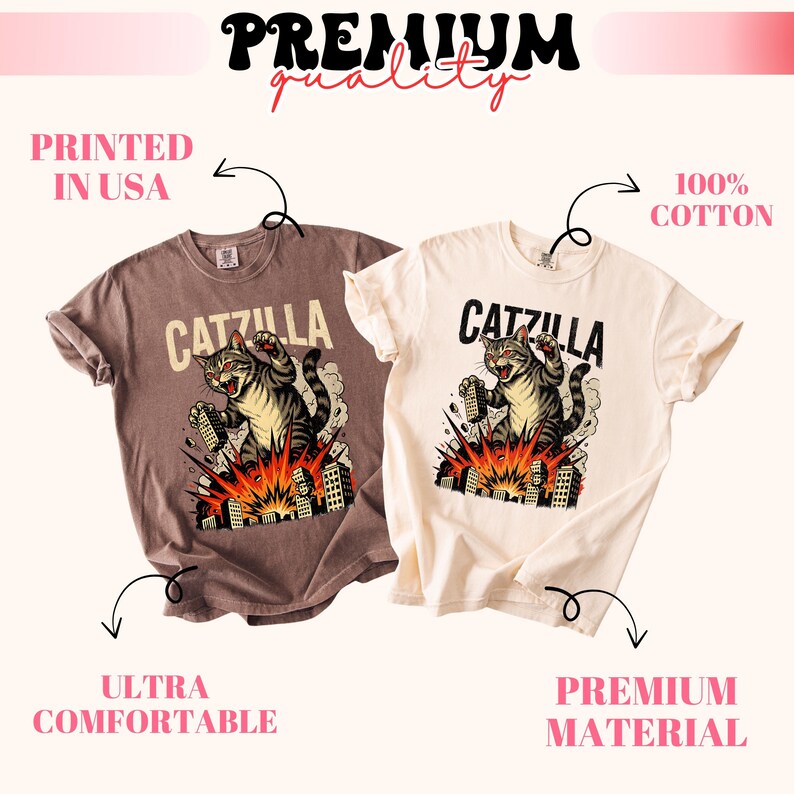 May include: Two t-shirts, one brown and one cream, feature a graphic of a cat labeled "CATZILLA" destroying a city. The shirts are labeled "Printed in USA", "Ultra Comfortable", "100% Cotton", and "Premium Material".