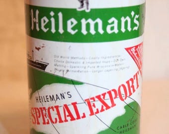 Könnte beinhalten: Vintage Heileman's Special Export Bierdose. Die Dose hat ein grün-weißes Design mit dem Markennamen in großen, weißen Buchstaben. Sie zeigt eine Grafik eines Mannes in grüner Kleidung und den Text "BREWED AND CANNED ONLY BY G. HEILEMAN BREWING COMPANY LA CROSSE WISCONSIN U.S.A."