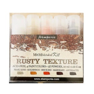 May include: A set of four paint colors and a 3D powder in a clear plastic box. The paint colors are pearl sand, goldenrod, brick red, and mahogany. The box has the text "Stamperia Mix Media Art Kit Rusty Texture Acid-Free, 4 Paint Colors + 3D Powder, 20 ml - 0.68 fl oz Pearl Sand - Goldenrod - Brick Red - Mahogany - Anthracite www.stamperia.com".