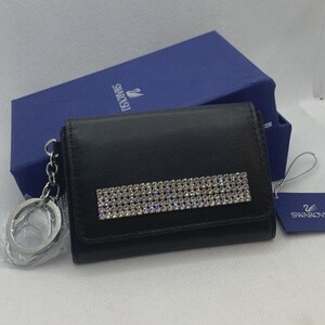 Petit portefeuille porte-cartes en cuir noir SWAROVSKI avec cristaux Swarovski