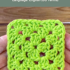 May include: A bright lime green crochet granny square with a classic openwork design. The text above reads: CLASSIC GRANNY SQUARE Step-by-Step Crochet Pattern. Skill Level: Beginner Friendly. Language: English (US Terms). The square is square-shaped.