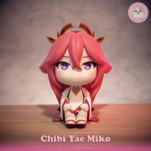 May include: A chibi figurine of Yae Miko, featuring a large head and small body. The figure has pink hair, purple eyes, and wears a white and red outfit. The base is brown, and the background is a gradient of pink and gray. The text "Chibi Yae Miko" is at the bottom.