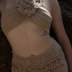 Crochet suit.Handmade crocheted cotton suit. Top with a flower at the back with ties and a short skirt. image 4