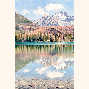 May include: A watercolour painting of a mountain lake with a clear reflection of a triangular hotel building, a dense forest of pine trees with autumn-coloured needles, and snow-capped jagged mountain peaks under a bright blue sky with white clouds.