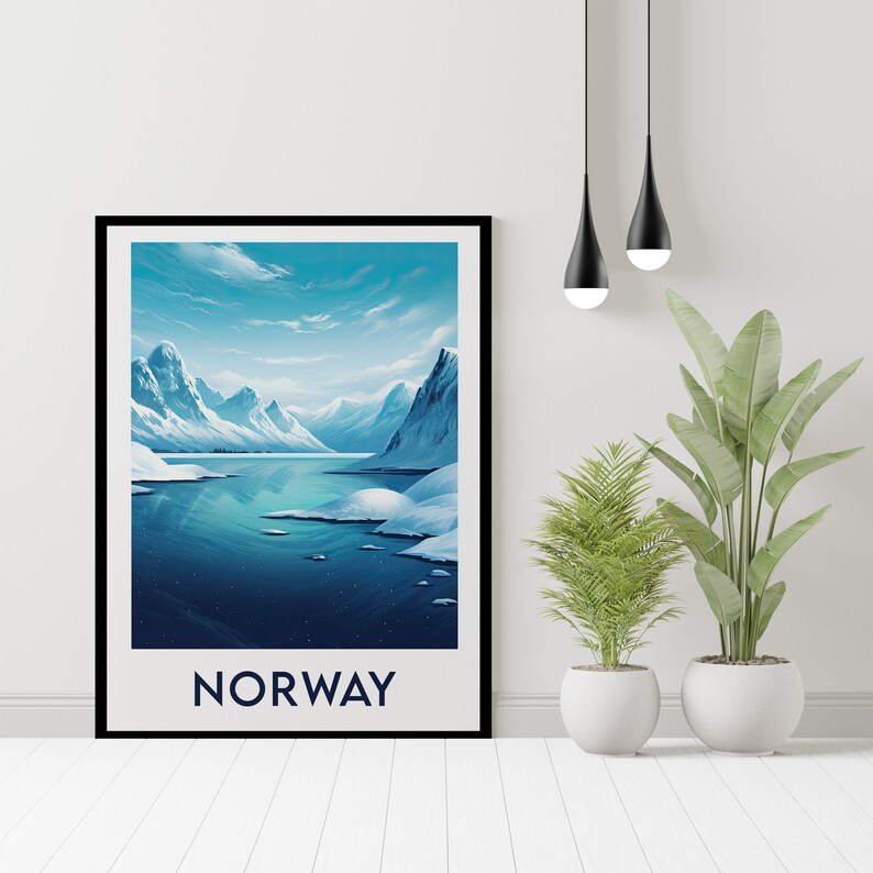 May include: A framed poster with a scenic view of a snow-capped mountain range and a body of water. The sky is blue with white clouds. The text "NORWAY" is printed in blue at the bottom of the poster.