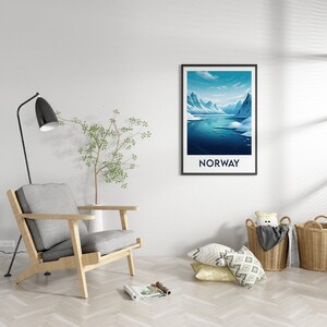 May include: A framed poster with a blue and white illustration of a mountain range and a lake with the word "NORWAY" printed below the image.