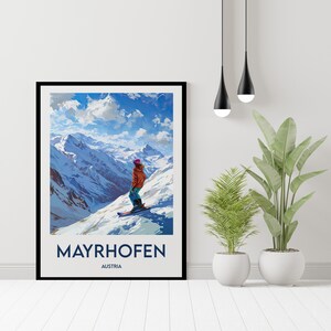 May include: A retro-style poster featuring a skier on a mountaintop overlooking a snowy valley. The poster is titled "MAYRHOFEN AUSTRIA".