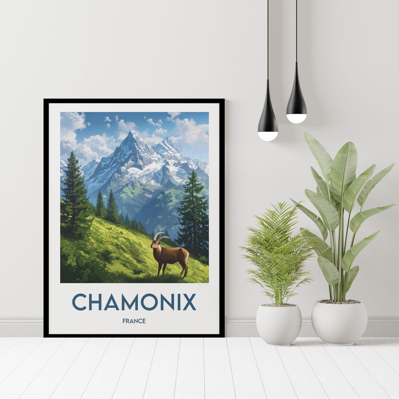 May include: A framed poster featuring a scenic mountain landscape with a brown mountain goat in the foreground. The poster has the text "Chamonix France" at the bottom.