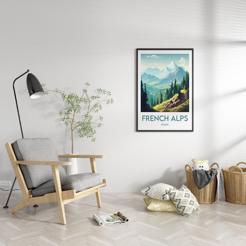 May include: A framed art print featuring a scenic view of the French Alps. The artwork showcases a mountain range with green valleys and blue skies. The print is labeled "FRENCH ALPS FRANCE" in white text on a black frame.