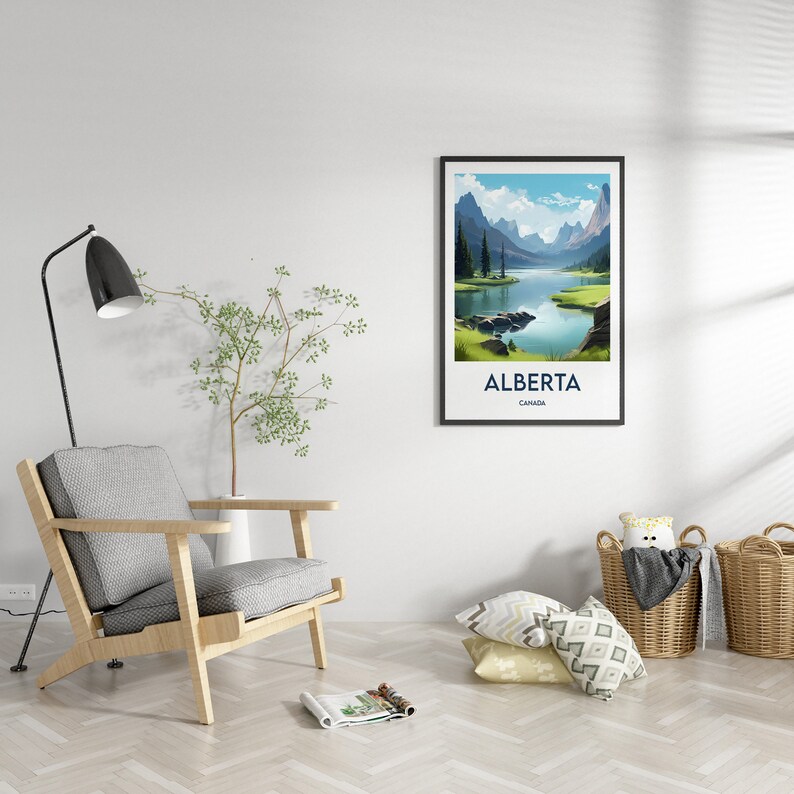 May include: A framed poster featuring a scenic view of a lake and mountains in Alberta, Canada. The poster has a blue and white colour scheme and the text "ALBERTA CANADA" is printed at the bottom.