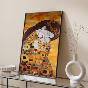 May include: A framed painting of a mother and child embracing. The painting is in a modern style with a gold background and geometric shapes. The mother has long brown hair and is wearing a white dress. The child is wearing a white dress and has closed eyes.