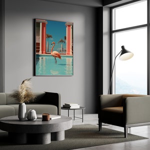 May include: A modern living room interior with a gray sofa, a round coffee table, and a gray armchair. A large framed print of a pink flamingo standing in a pool hangs on the wall. The room has a large window with a view of a mountain range.