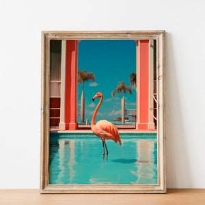 May include: A framed print of a pink flamingo standing in a turquoise swimming pool. The pool is surrounded by red pillars and palm trees. The sky is blue and the water is clear.