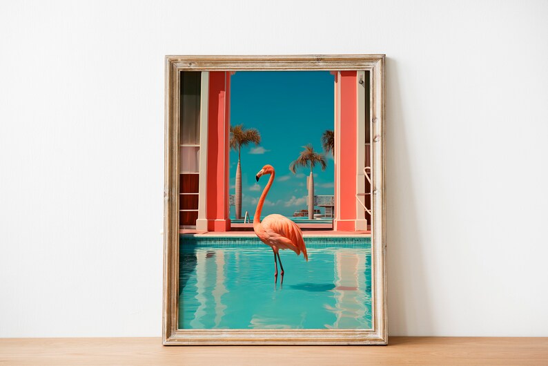 May include: A framed print of a pink flamingo standing in a turquoise swimming pool. The pool is surrounded by red pillars and palm trees. The sky is blue and the water is clear.