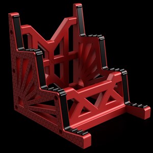 K&ouml;nnte beinhalten: Ein roter geometrischer St&auml;nder mit schwarzen Akzenten. Der St&auml;nder hat ein einzigartiges Design mit einem Wabenmuster und ist aus robustem Material gefertigt.