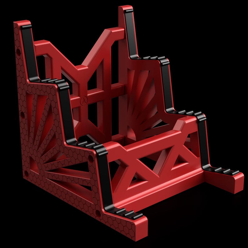 K&ouml;nnte beinhalten: Ein roter geometrischer St&auml;nder mit schwarzen Akzenten. Der St&auml;nder hat ein einzigartiges Design mit einem Wabenmuster und ist aus robustem Material gefertigt.