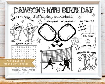 May include: Black and white printable party activity sheet for a 10th birthday party with a pickleball theme. The sheet includes a word search, spot the difference, tic tac toe, a maze, and a section to decorate pickleball paddles.