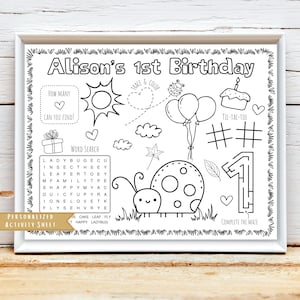 May include: Black and white printable activity sheet for a 1st birthday party. The sheet features a word search, a connect-the-dots maze, a tic-tac-toe game, and a ladybug with a trace and color activity. The sheet is personalized with the name "Alison's 1st Birthday".