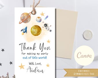 May include: A white thank you tag with a watercolor illustration of planets, stars, a rocket, and an astronaut. The text reads "Thank You for making my party out of this world! With Love, Aidan".