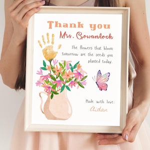 May include: A printable thank you card for a teacher with a handprint, flowers in a vase, and a butterfly. The card reads "Thank you Mrs. Gowanlock. The flowers that bloom tomorrow are the seeds you planted today. Made with love: Aidan."
