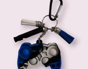 Llavero antiestrés con forma de burbuja: silbato, borla, clip para bolso. Decoración para bolso o llave.