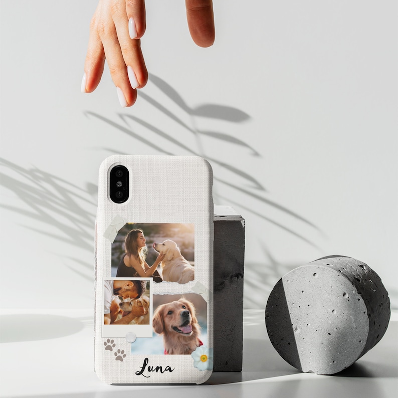 May include: White phone case with a textured fabric design. The case features three photos: a woman with a dog, a couple with a dog, and a dog. The case also has a paw print design and the name "Luna" written on it.