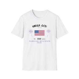 May include: A white short-sleeve t-shirt featuring a graphic with the text UNDER GOD USA, a United States flag, two firework illustrations, and the text for 250 years PARRISH REUNION 2026 printed in black and blue ink on the center of the chest.