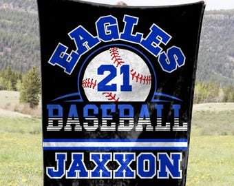May include: Black and blue personalized baseball blanket with the text "Eagles Baseball Jaxxon" and a baseball with the number 21.