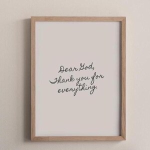 May include: A framed print with the text "Dear God, thank you for everything." in black cursive writing on a white background.