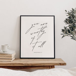 May include: Black and white framed print with the text "You are worthy of it all" and the scripture reference "Revelation 4:11".