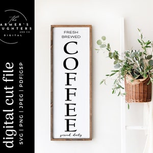 May include: A white sign with black text that reads "Fresh Brewed Coffee served daily". The sign is framed in wood and has a rustic look.