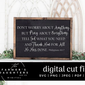 May include: A black sign with white text that reads "Don't worry about anything, but pray about everything. Tell God what you need and thank him for all he has done. Philippians 4:6-7". The sign is framed in wood and is sitting on a white surface.