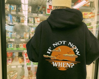 May include: Black hooded sweatshirt with a graphic print of a sunset and the text "If not now when?" on the back.