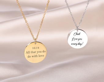 May include: Two silver necklaces with round pendants. The pendant on the left necklace says "16:14 All that you do do with love". The pendant on the right necklace says "Chad Love you every day!"