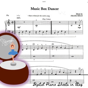 May include: A sheet music score for a piano piece titled "Music Box Dancer" by Frank Mills. The sheet music includes musical notation, a title, and instructions to play the song three times. A whimsical illustration of a ballerina in a music box is featured on the left side of the page.