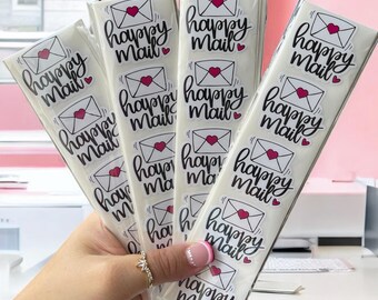 May include: A set of clear sticker sheets with pink hearts and the text "happy mail" in black script.