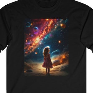 May include: A black long-sleeve t-shirt with a colorful galaxy print featuring a small figure of a girl standing in the foreground.