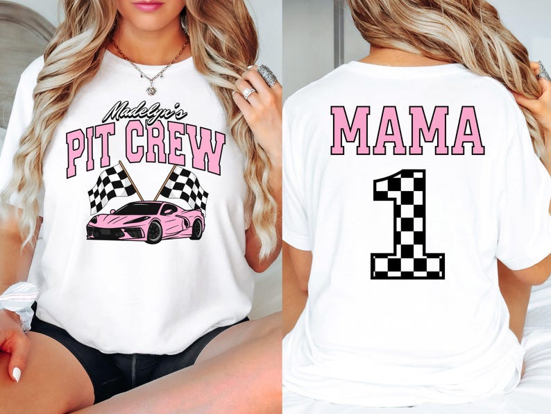 May include: Two white t-shirts with a racing theme. The front shirt says "Madelyn's Pit Crew" with a pink race car and checkered flags. The back shirt says "MAMA" with a large pink number "1" with a checkered flag design.