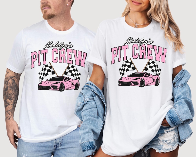 May include: Two white t-shirts with pink text that reads "Madelyn's Pit Crew" and a pink race car with checkered flags.