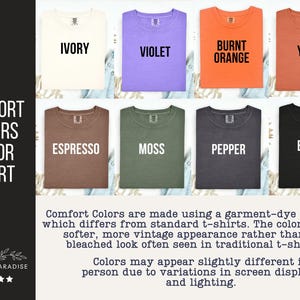 May include: A Comfort Colors color chart featuring eight t-shirts in ivory, violet, burnt orange, yam, espresso, moss, pepper, and black. The text reads Comfort Colors Color Chart, Shop of Paradise, and includes a description of the garment-dye process.