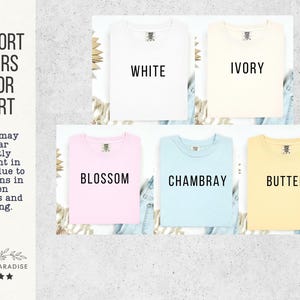 May include: A color chart displaying t-shirts in various colors: white, ivory, blossom, chambray, and butter. The text "Comfort Colors Color Chart" is at the top, with "Shop of Paradise" at the bottom. The colors may appear slightly different due to screen variations.