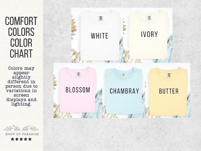 May include: A color chart displaying t-shirts in various colors: white, ivory, blossom, chambray, and butter. The text "Comfort Colors Color Chart" is at the top, with "Shop of Paradise" at the bottom. The colors may appear slightly different due to screen variations.