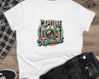 May include: White t-shirt with a vintage-style camera graphic and the text "CAPTURE the MOMENT".