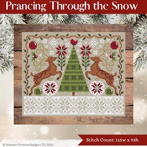 May include: Cross-stitch design titled "Prancing Through the Snow." The design features two reindeer, a Christmas tree, snowflakes, and ornaments in red, green, and white. The stitch count is 115w x 93h.