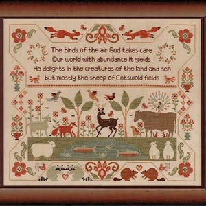 May include: Framed cross-stitch artwork featuring a pastoral scene with animals, trees, and a pond. The design includes sheep, deer, birds, and fish, with text that reads "The birds of the air God takes care". The frame is a dark brown color.