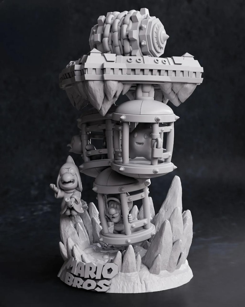 May include: A gray 3D-printed sculpture featuring characters from the Mario Bros. video game. The sculpture includes characters in cages, a floating platform, and the Mario Bros. logo on the base. The sculpture has a detailed, textured design.