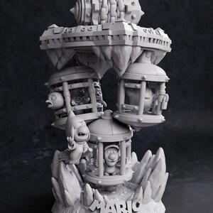 May include: A gray 3D-printed sculpture featuring characters from the Mario Bros. video game series. The sculpture includes characters in cages, a floating platform, and the words "Mario Bros" at the base.