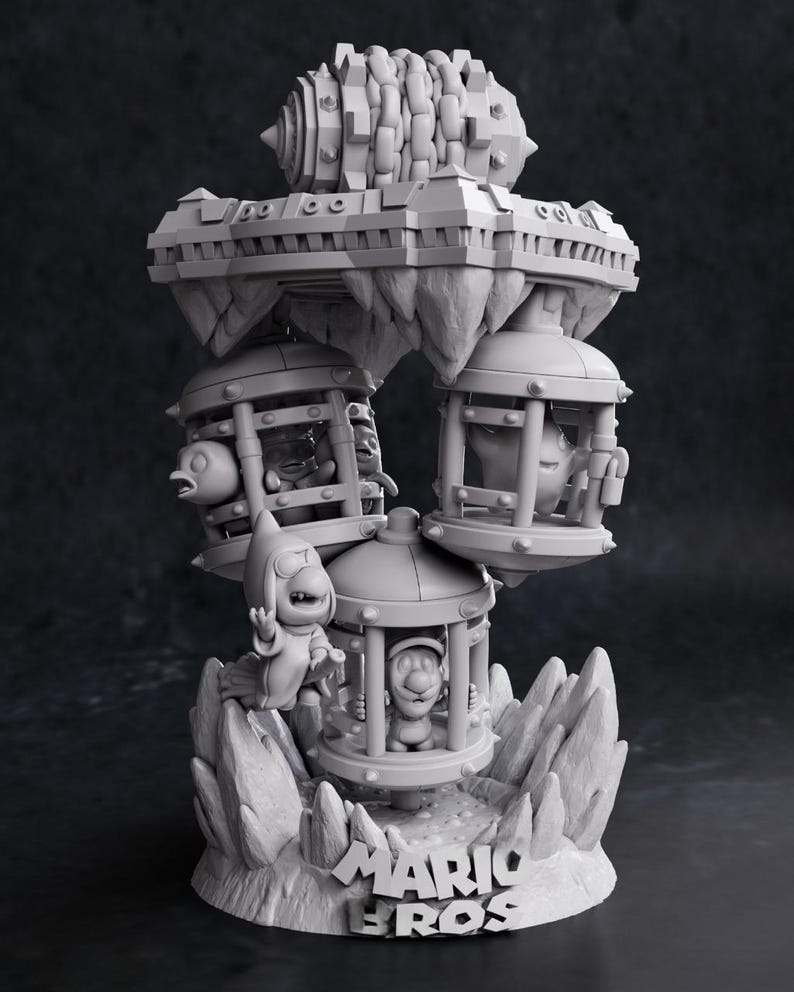 May include: A gray 3D-printed sculpture featuring characters from the Mario Bros. video game series. The sculpture includes characters in cages, a floating platform, and the words "Mario Bros" at the base.