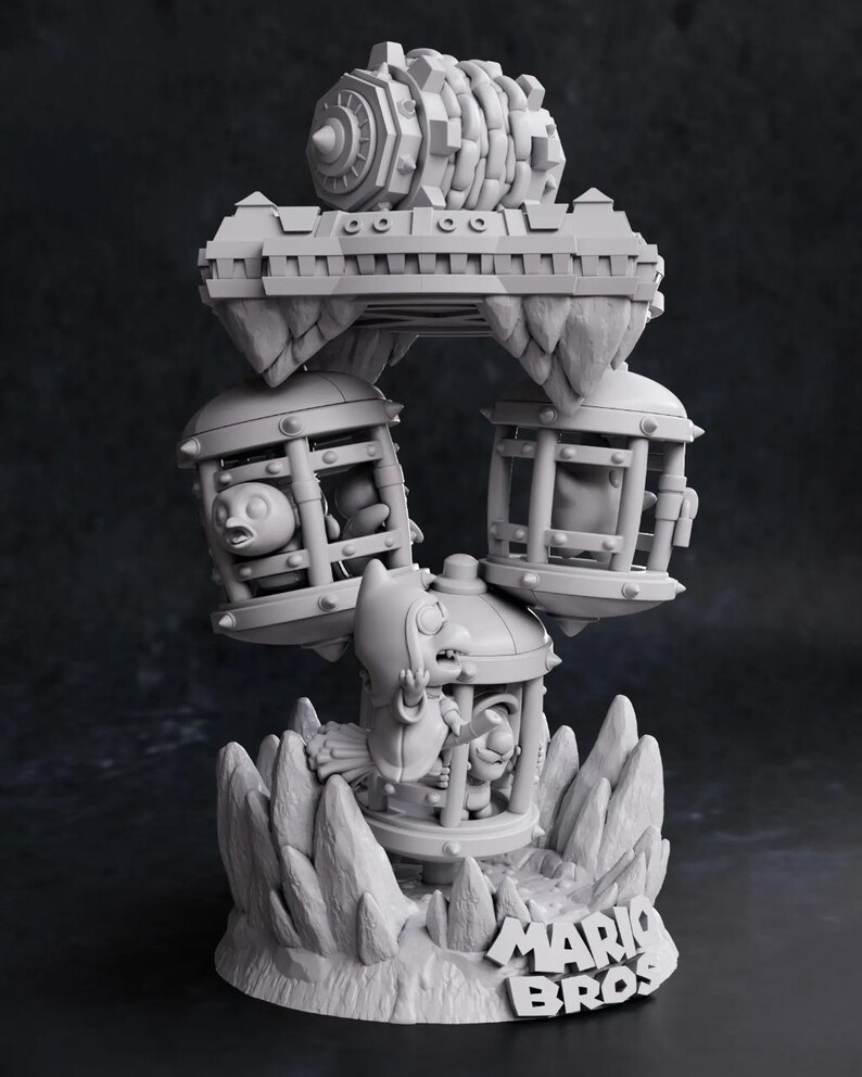 May include: A gray 3D-printed sculpture featuring characters and elements from the Mario Bros. video game series. The sculpture includes cages, a bridge, and a large gear-like structure, all set on a rocky base with the Mario Bros. logo.
